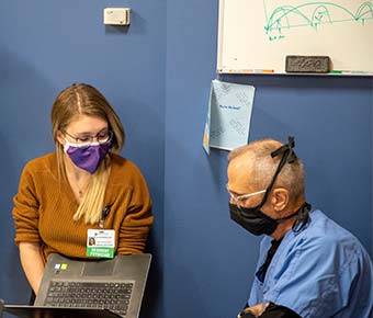 Resident Dr. Prosser consulting with Preceptor Dr. Bruner