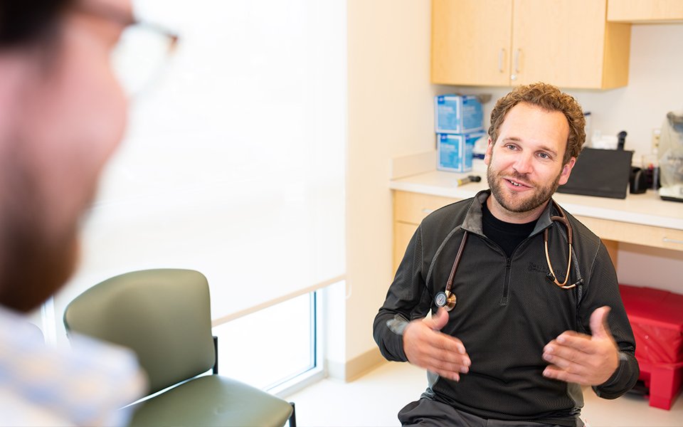 Dr. Braniecki speaking to a patient