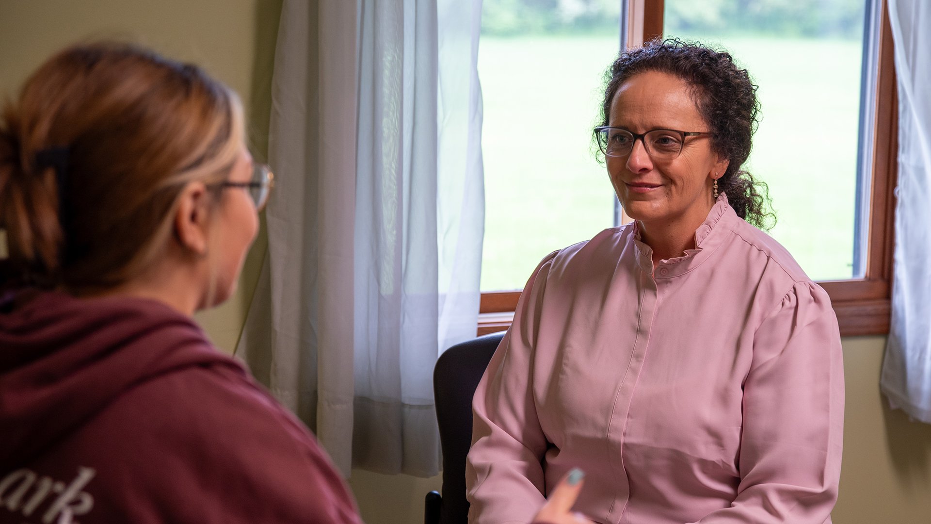 A counselor talks to a client